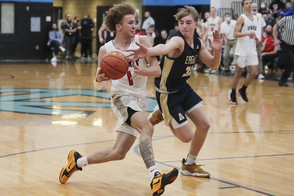 Ferris’ Trayce Atkins drives to the hoop Saturday against Arlington in a boys 3A regional game at Central Valley High School. (Cheryl Nichols/For The Spokesman-Review)