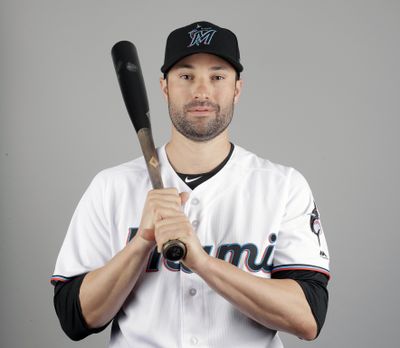 Neil Walker of the Miami Marlins baseball team poses Wednesday, Feb. 20, 2019, in Jupiter, Fla. While Manny Machado agreed to a pending $300 million, 10-year contract with San Diego and Bryce Harper is likely to top Giancarlo Stanton’s record $325 million, 13-year deal, many less-than-superstar veterans have been routed on the free-agent market. Walker’s salary dropped from $17.2 million to $2 million in two years. (Jeff Roberson / Associated Press)