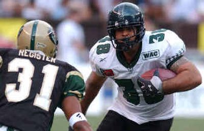 Hawaii wide receiver Gerald Welch (38) looks to avoid Alabama-Birmingham's Brandon Register.
(Associated Press / The Spokesman-Review)