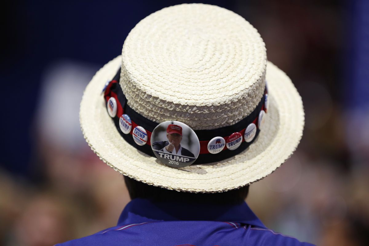 FILE - In this July 20, 2016 file photo, a delegate shows off support for Republican Presidential Candidate Donald Trump during the third day session of the Republican National Convention in Cleveland. The Republican National Committee is sharply restricting attendance on three of the four nights of its convention in Jacksonville, Florida, next month as coronavirus cases are spiking in the state.  (Carolyn Kaster)