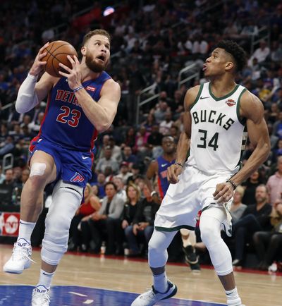 Detroit Pistons forward Blake Griffin (23) attempts a layup as Milwaukee Bucks forward Giannis Antetokounmpo (34) defends during the second half of Game 4 of a first-round NBA basketball playoff series, Monday, April 22, 2019, in Detroit. (Carlos Osorio / Associated Press)