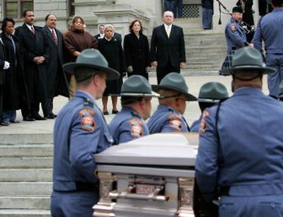 
The Rev. Bernice King, left, Dexter King, Martin Luther King III, Yolanda King, Atlanta Mayor Shirley Franklin, Georgia first lady Mary Perdue and Gov. Sonny Perdue look on Saturday as the casket of Coretta Scott King is carried up the steps of the Capitol to lie in honor in the rotunda in Atlanta. 
 (Associated Press / The Spokesman-Review)