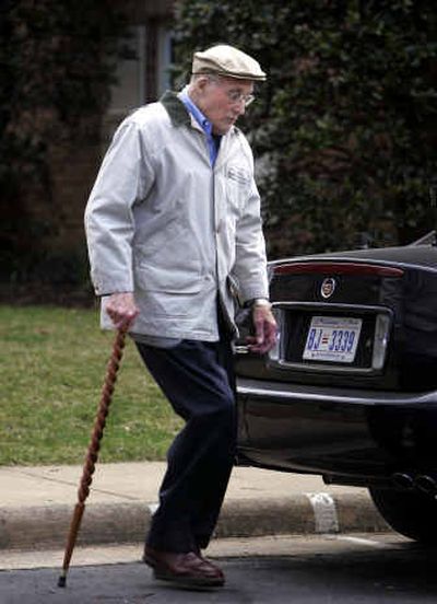 
Chief Justice William  Rehnquist walks to his car on Monday. 
 (Associated Press / The Spokesman-Review)
