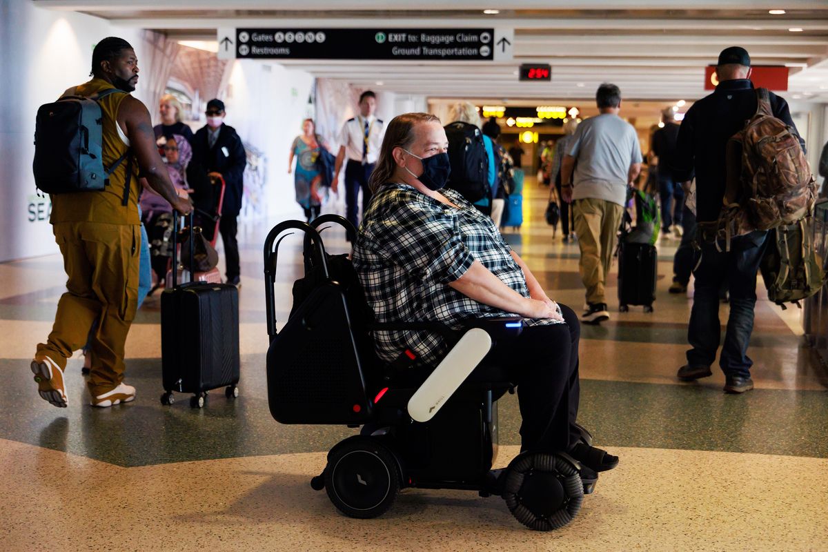 Billings resident Tina Gellos travels to her gate using an autonomous wheelchair Oct. 3 at the Seattle-Tacoma International Airport.  (Erika Schultz/The Seattle Times/TNS)