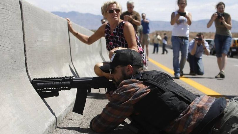 Protester Eric Parker aims his weapon in April 2014 from a bridge next to the Bureau of Land Management’s base camp where seized cattle, belonging to rancher Cliven Bundy, were held near Bunkerville, Nev. (Reuters / Jim Urquhart )