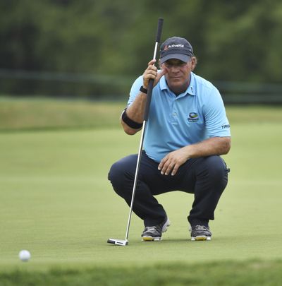 Scott McCarron lines up his putt on the fourth hole during the third round of the Constellation Senior Players Championship golf tournament at Exmoor Country Club in Highland Park, Ill., Saturday, July 14, 2018. (Joe Lewnard/Daily Herald via AP) ORG XMIT: ILARL104 (Joe Lewnard / AP)