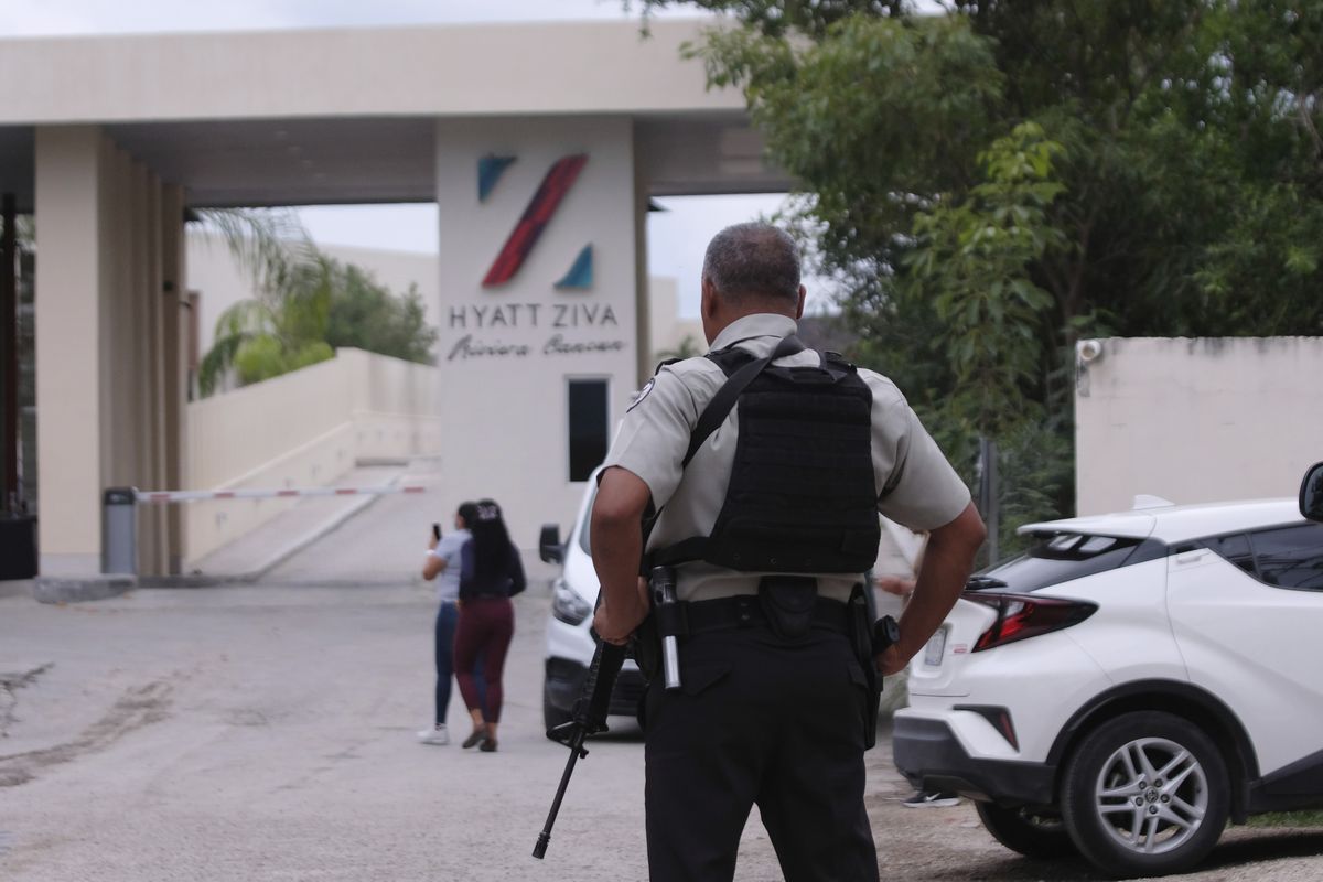 Government forces guard the entrance of hotel after an armed confrontation near Puerto Morelos, Mexico, Thursday, November 4, 2021. Two suspected drug dealers were killed after gunmen from competing gangs staged a dramatic shootout near upscale hotels that sent foreign tourists scrambling for cover.  (Karim Torres)
