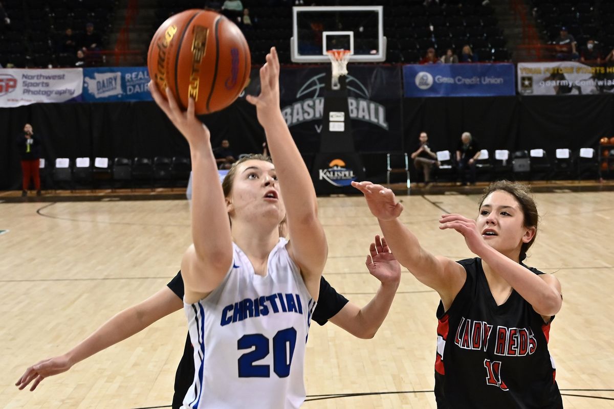 Mount Vernon Christian Hurricanes Ruthie Rozema (20) shoots the ball against Neah Bay Red Devils guard Cerise Moss (11) in the first half of the State 1B Girls Championship basketball game at the Spokane Arena on Sat, March. 5, 2022 in Spokane WA.  (James Snook for The Spokesman-Review)