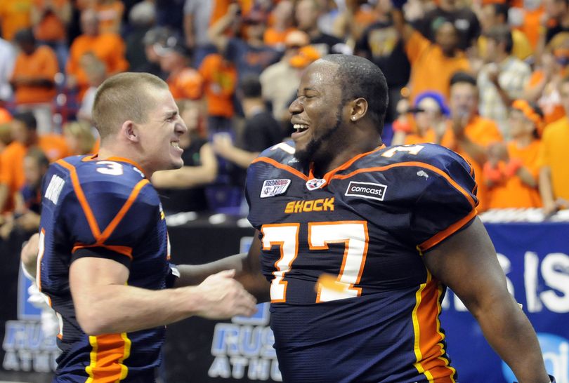 Spokane Shock quarterback Kyle Rowley,left, and defensive lineman Richard Clebert celebrate their 69-5 win over the Tampa Bay Storm in Arena Bowl XXlll at the Spokane Arena in Spokane, Wash. Friday August 20, 2010. (Christopher Anderson / Spokesman-Review)