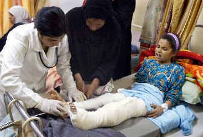 An 8-year-old girl, injured when her home about 25 miles south of Baghdad came under a mortar attack Monday, is treated in a hospital in Baghdad.
(Associated Press / The Spokesman-Review)