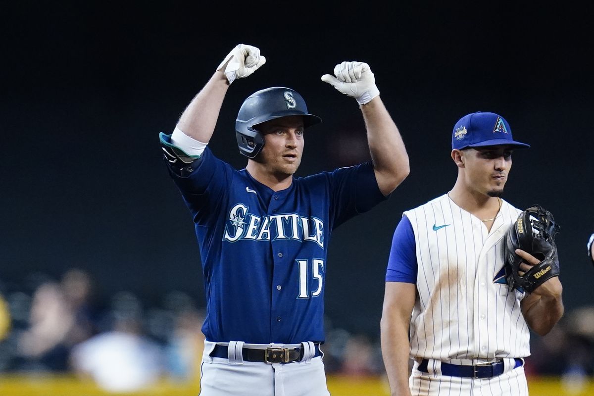 Seattle’s Kyle Seager celebrates a two-run double during the 11th inning of a win over Arizona in Phoenix Sunday.  (Associated Press)