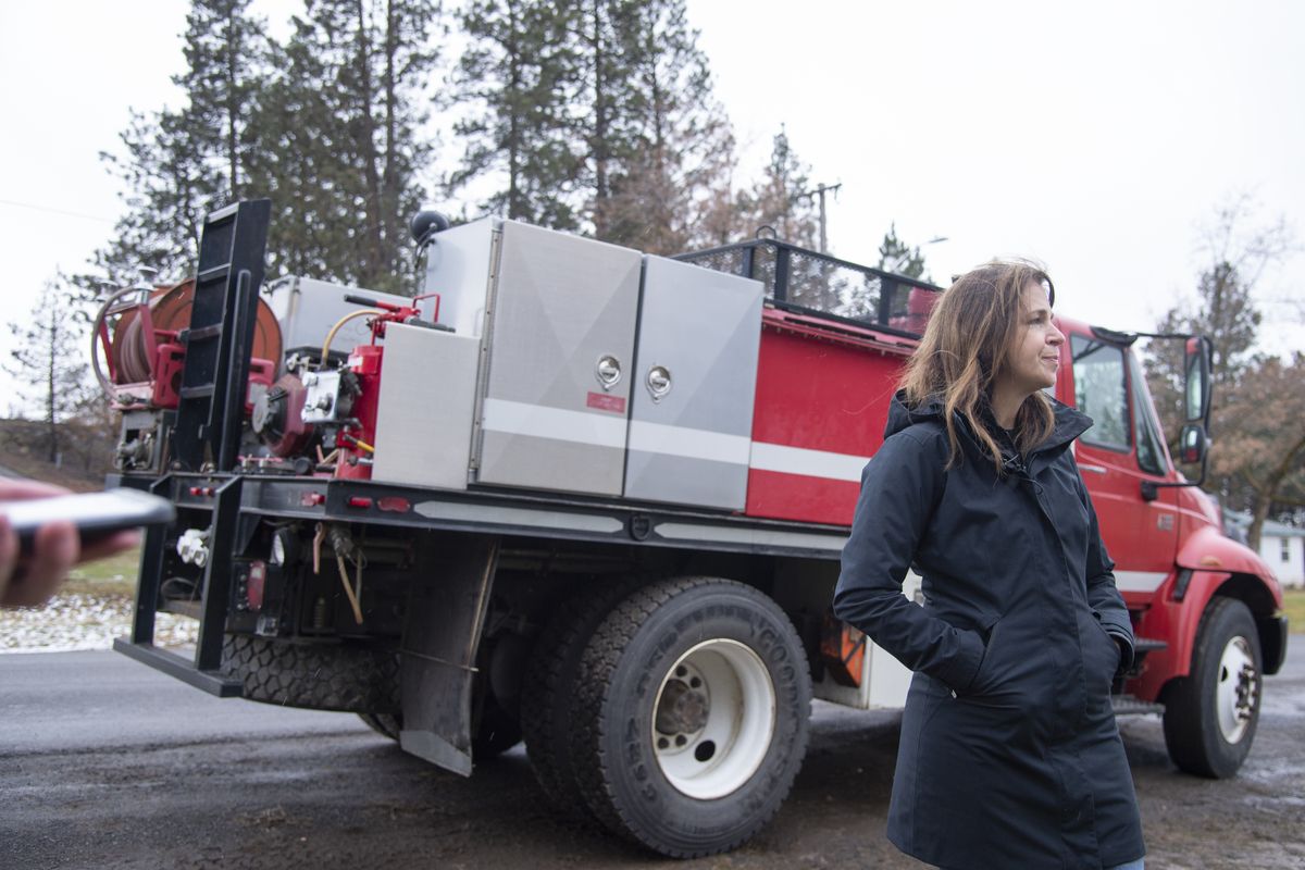 Washington state Commissioner of Public Lands Hilary Franz answers questions from reporters next to the used fire truck she delivered on Dec. 17, 2020, in Malden, Washington. .  (Jesse Tinsley/The Spokesman-Review)