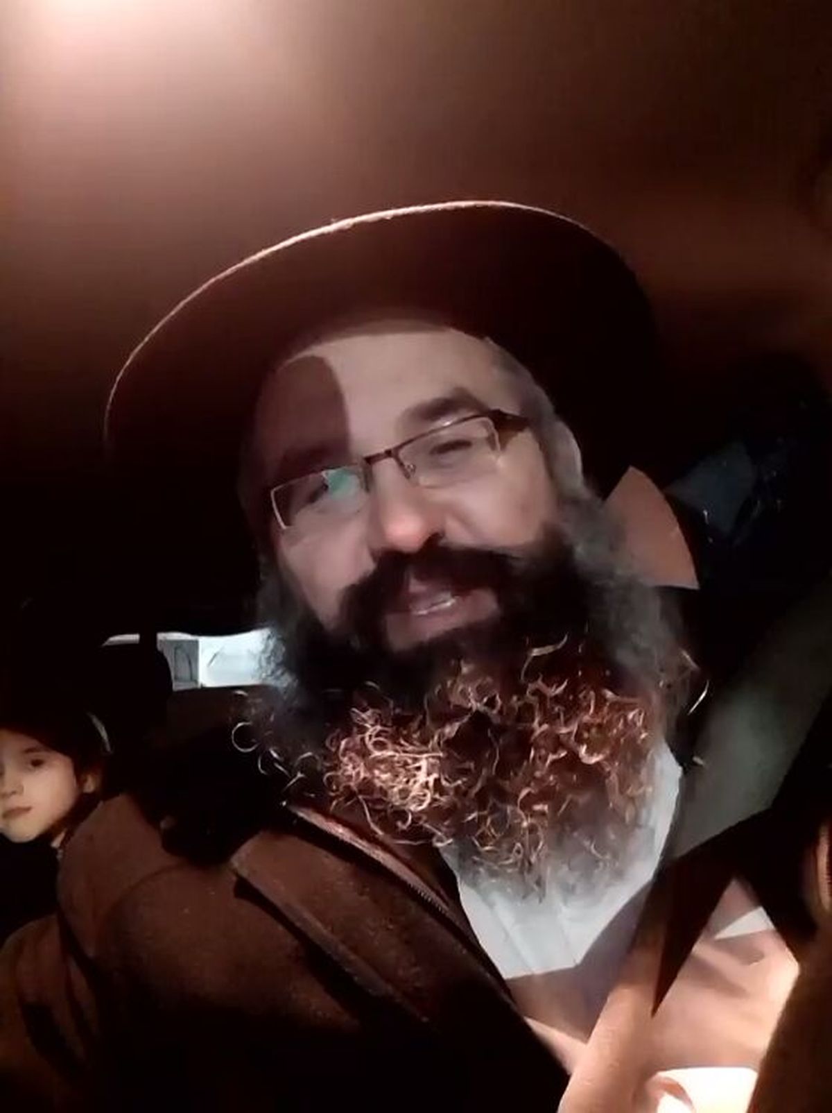 Rabbi Yechiel Shlomo Levitansky speaks on a Zoom call Tuesday while traveling to board a flight from Romania to Israel. Levitansky, who’s lived and taught in Ukraine for 17 years, fled the city of Sumy with his family last week.  (Kip Hill/Zoom)