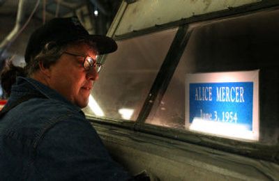 
Marker engraver Carl Ellis sandblasts a replacement grave marker for Woodlawn Cemetery in the shop at Fairmount Memorial Cemetery in north Spokane. Old wooden markers erected at Woodlawn by SCOPE members  are being updated with stone markers. Fairmount Memorial Association expects to break ground on a columbarium at Woodlawn by midsummer.
 (Liz Kishimoto / The Spokesman-Review)