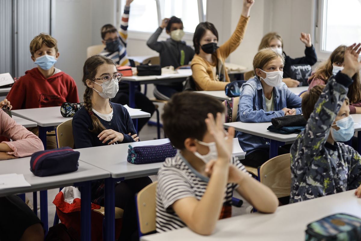 In this Sept. 2, 2021 photo, children sit in a classroom at school in Strasbourg, eastern France. Children across Europe are going back to school, with hopes of a return to normality after 18 months of pandemic disruption and fears of a new surge in infections from the highly infectious delta variant of the coronavirus.  (Jean-Francois Badias)