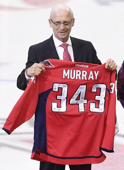 FILE - This Jan. 24, 2017 photo shows senior hockey advisor to the Ottawa Senators, Bryan Murray, holding a signed Washington Capitals jersey as he is inducted as the first member of the Ottawa Senators new 