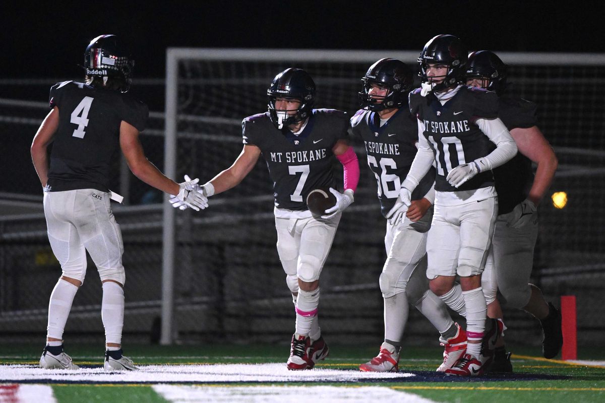 Mt. Spokane Wildcats Matteo Saccomanno (7) and Mt. Spokane Wildcats Bode Gardner (4) celebrate a touchdown against the Cheney Blackhawks in the first half at Union Stadium on Oct. 12, 2023, in Spokane.  (James Snook/THE SPOKESMAN-REVIEW)