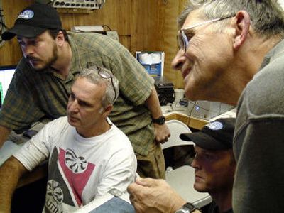 
From left, Mike Kelly, Kevin Beck, Jay Lerner and project leader Art Wright look at a  target that could possibly be the USS Grunion from their base on the crabbing boat Aquila in early August 2006. 
 (Photo COURTESY OF BRUCE ABELE / The Spokesman-Review)