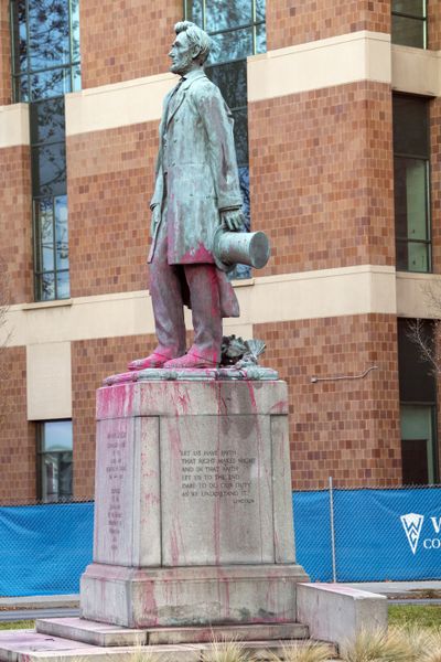 Red paint was splashed over the Abraham Lincoln statue at Monroe Street and Main Avenue. The vandalism was discovered Thursday morning.  (Jesse Tinsley/The Spokesman-Review)