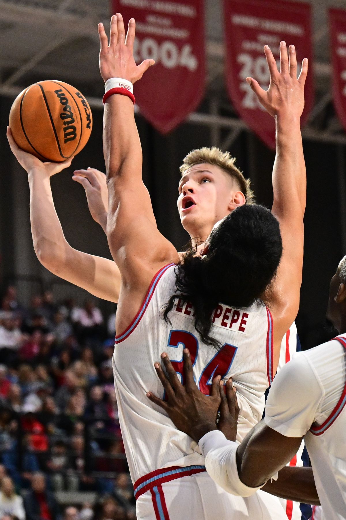 Gonzaga forward Ben Gregg rises for a layup against Loyola Marymount forward Keli Leaupepe on Thursday.  (Tyler Tjomsland/The Spokesman-Review)