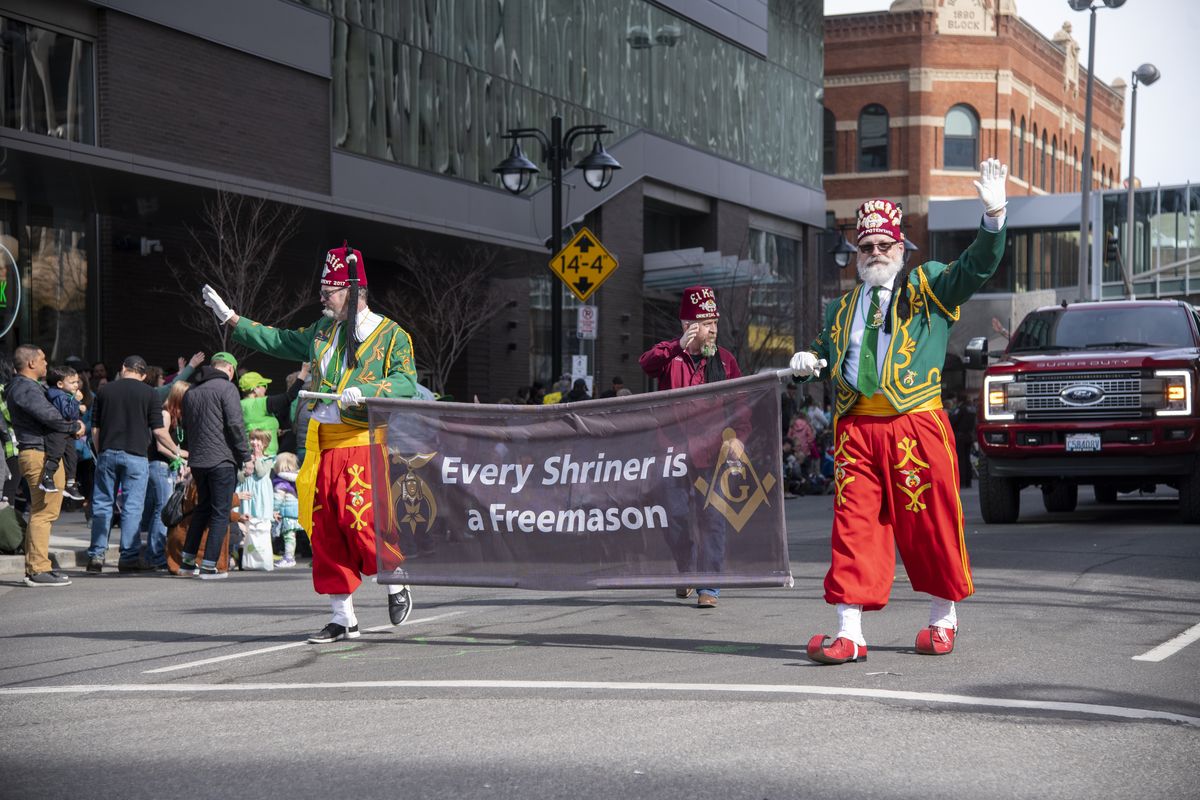 Members of the El Katif Shriners group walk in the annual St. Patrick