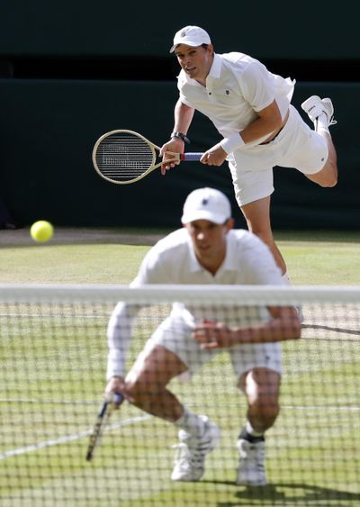 U.S. doubles players Mike Bryan, front, and Bob Bryan, who won the gold medal at the 2012 London Games, pulled out of the Rio Games because of health concerns. (Ben Curtis / Associated Press)
