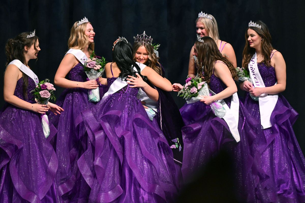 Raegan Miller, center, facing forward, of University High School, receives hugs from the Royal Court after hearing her named called as the 2025 Lilac Queen, Sunday March 30, 2025, during the Spokane Lilac Festival Association Queen & Court Coronation at Spokane Community College. (DAN PELLE/FOR THE SPOKESMN-REVIEW)