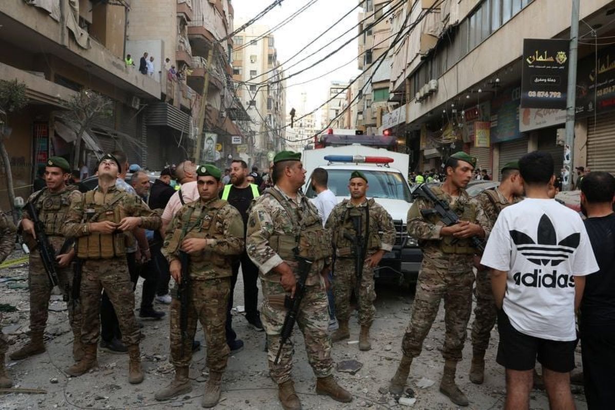 Members of the Lebanese army secure the area near the site of an Israeli strike, after Israeli military said on Sunday that it struck a militant from the Lebanese Iran-aligned Hezbollah group, in Beirut