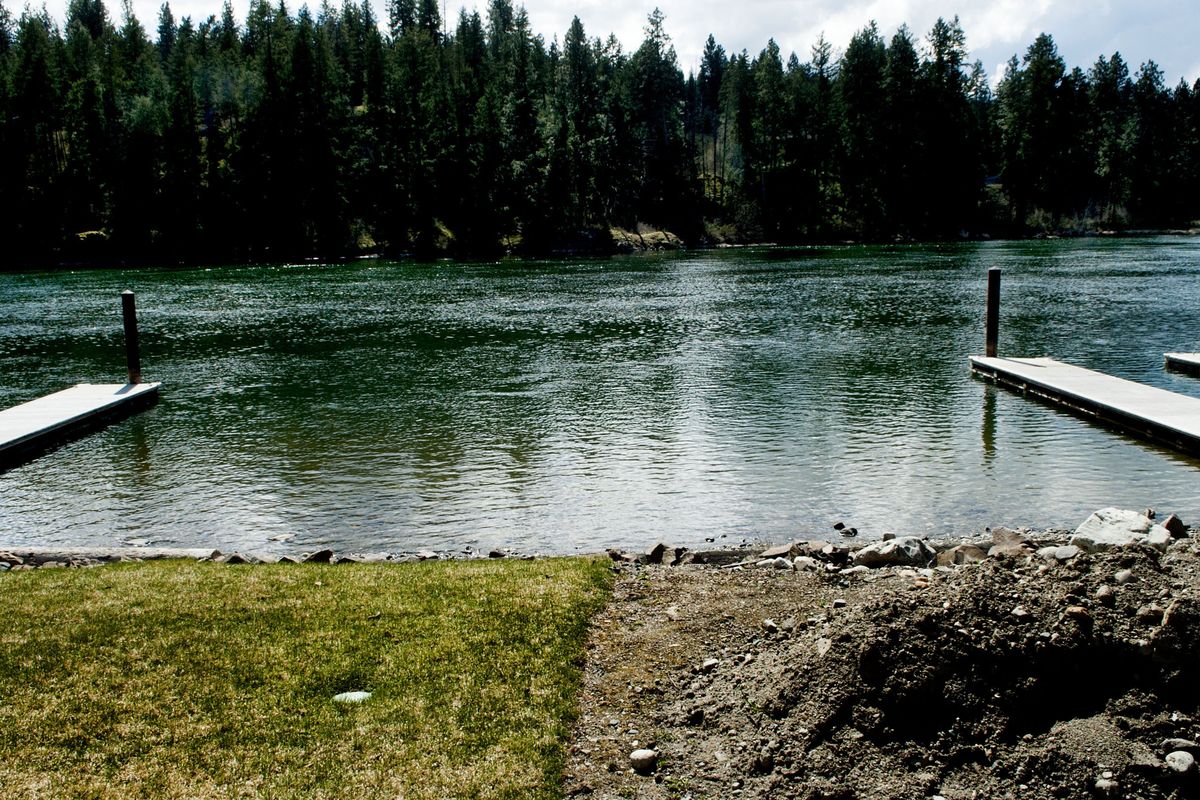 Bare ground awaits seeding near the Spokane River on Thursday. Kootenai County is considering easing shoreline regulations. (Kathy Plonka)