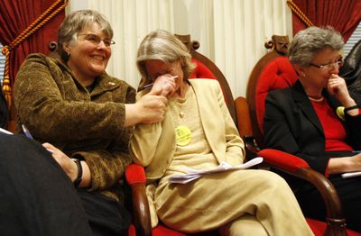Gay marriage advocate Beth Robinson, center, holds back tears following the passage of a gay marriage bill in Montpelier, Vt., Tuesday, making Vermont the fourth state to legalize gay marriage. (Associated Press / The Spokesman-Review)