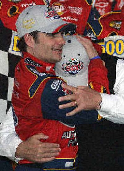 
NASCAR driver Jeff Gordon gives car owner Rick Hendrick a hug in Victory Lane at Daytona International Speedway on Sunday. 
 (Associated Press / The Spokesman-Review)