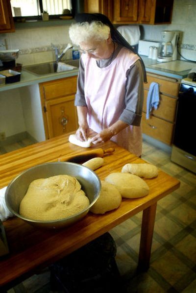 
Sister Mona prepares bread for baking at Desert House. 
 (The Spokesman-Review)