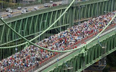 
Thousands travel across the bridge deck Sunday. Associated Press
 (Associated Press / The Spokesman-Review)