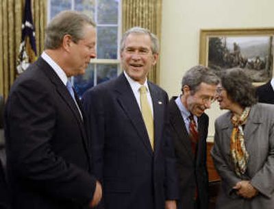 
President Bush stands Monday with Al Gore, a 2007 Nobel Prize recipient, in the Oval Office of the White House in Washington. Associated Press
 (Associated Press / The Spokesman-Review)