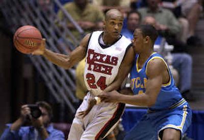 
UCLA's Arron Affialo, right, kept his nose to the grindstone but couldn't stop Texas Tech's Ronald Ross during Thursday's NCAA Tournament first-round opener. 
 (Dan Pelle / The Spokesman-Review)