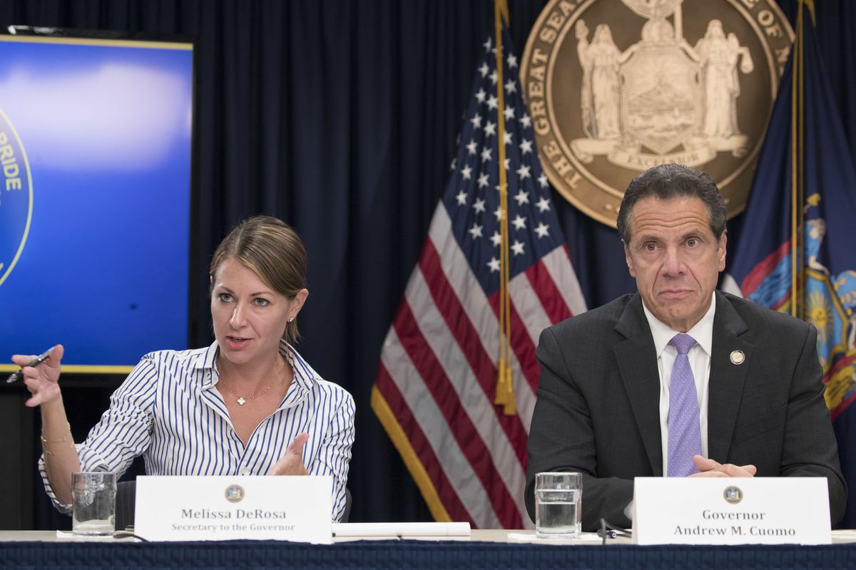 FILE — In this Sept. 14, 2018 file photo, Secretary to the Governor Melissa DeRosa, is joined by New York Gov. Andrew Cuomo as she speaks to reporters during a news conference, in New York. De Rosa, Cuomo