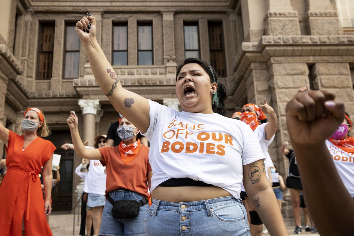FILE - Leen Garza participates in a protest with others against the six-week abortion ban at the Capitol in Austin, Texas, on Wednesday, Sept. 1, 2021. The Justice Department is asking a federal court in Texas to issue a temporary restraining order or a preliminary injunction against a new state law that bans most abortions in Texas. The emergency motion filed Tuesday night, Sept. 14 says a court can issue such an order as a means of preventing harm to parties involved before the court can fully decide the claims in the case.  (Jay Janner)