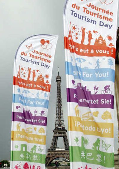 
Banners advertise the promotion of Paris Tourist Day on the Trocadero Plaza in front of the Eiffel Tower on Monday. Associated Press
 (Associated Press / The Spokesman-Review)