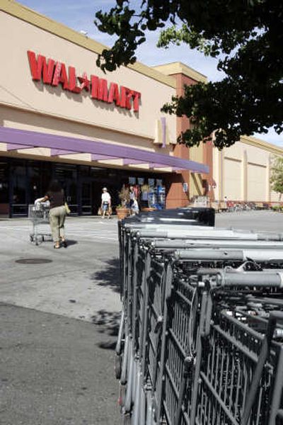 
Shoppers walk into a Wal-Mart store in Mountain View, Calif. Wal-Mart said Monday that it is cutting prices on back-to-school items and other products.  Associated Press
 (Associated Press / The Spokesman-Review)