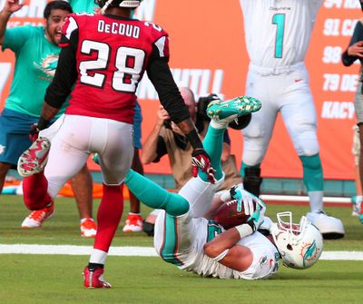 Miami Dolphins wide receiver Brian Hartline catches a pass from Ryan Tannehill in the end zone for a touchdown during the third quarter against the Atlanta Falcons. (Associated Press)