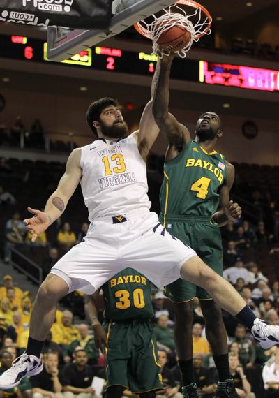 WVU’s Deniz Kilicli (13) gets the bucket, but Baylor got win Friday. (Associated Press)