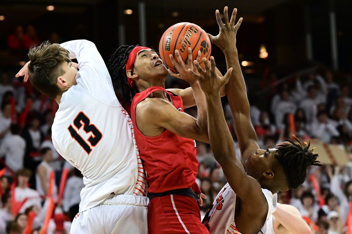 Ferris’s Sam Markham (11) battles Lewis and Clark in the paint during a high school boys basketball game on Tuesday, Jan 2023, at the Spokane Arena in Spokane, Wash.  (Tyler Tjomsland/The Spokesman-Review)