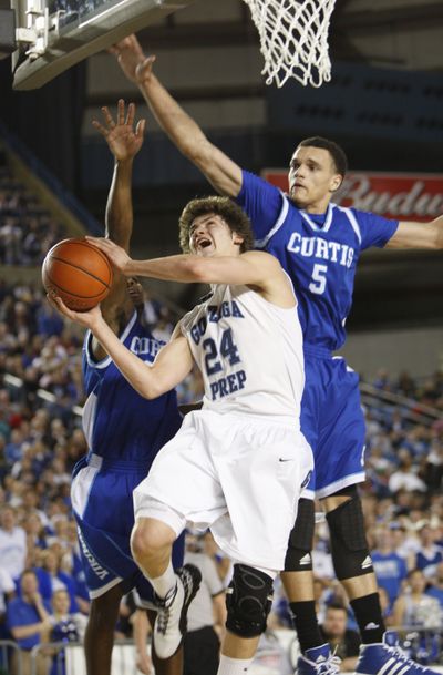 Curtis' James Cooks, left, defends as Gonzaga Prep's Chris Sarbaugh takes a shot with Curtis' Julian Vaughn coming in from behind. The Bulldogs won the 4A title on Saturday in the Tacoma Dome. (Kevin Casey / Associated Press)
