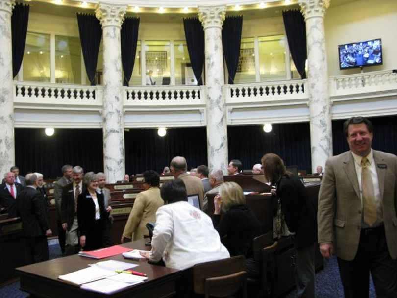 Departing representatives head for the well of the House to say their goodbyes on Thursday, the last day of Idaho's 2012 legislative session. (Betsy Russell)