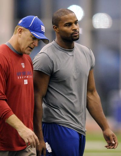 The saga continues for New York Giants DE Osi Umenyiora, who had knee surgery on Friday. (Associated Press)