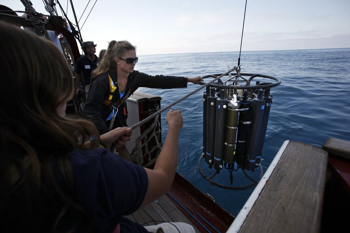 Students from the University of San Diego bring a CTD carousel water collection device back aboard on Sept. 14, 2013.