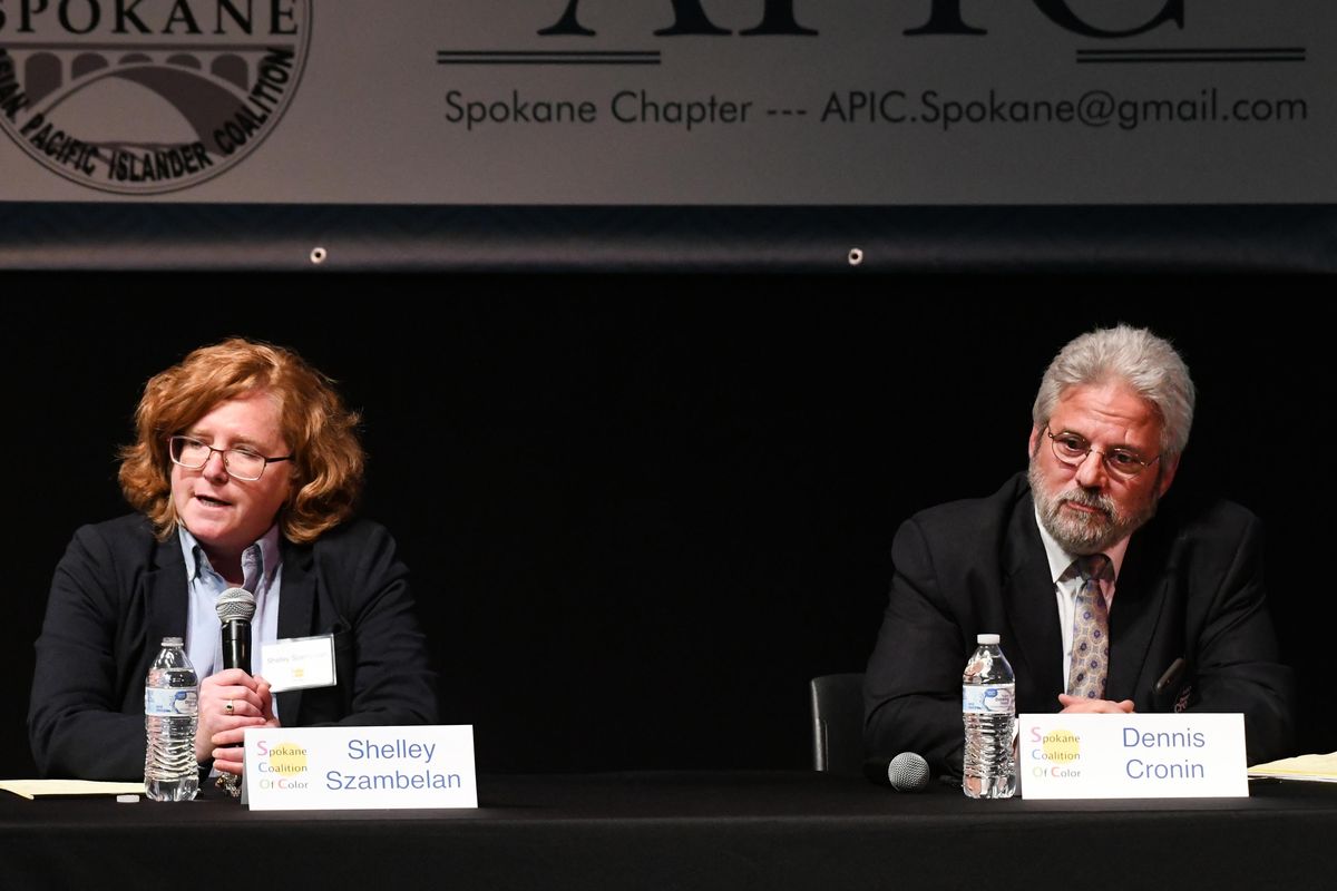 Shelley Szambelan, left, and Dennis Cronin make their statements in front of the crowd at the Coalition of Color candidate forum Tuesday, Oct. 9, 2018 at Spokane Community College. (Jesse Tinsley / The Spokesman-Review)