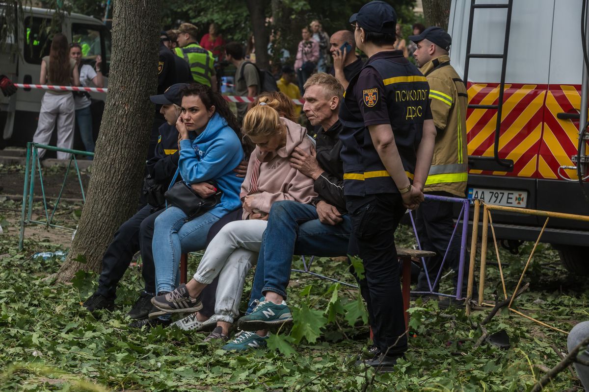 Kostiantyn fears his son Dmytro is inside a residential building that was damaged during a Russian missile strike in Kyiv and waits for rescue workers while they search the rubble on Tuesday. (Oksana Parafeniuk/for The Washington Post)