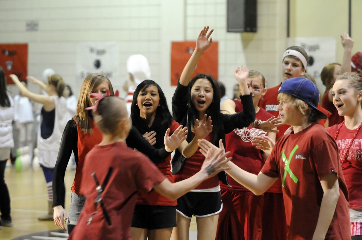 Sixth-graders from the Strikers team gather to cheer their bowlers during a sixth-grade bowling tournament last Thursday at Cheney Middle School. The two-hour event was part pep rally, part bowling competition and part party. THE SPOKESMAN-REVIEW (Photos by JESSE TINSLEY THE SPOKESMAN-REVIEW / The Spokesman-Review)