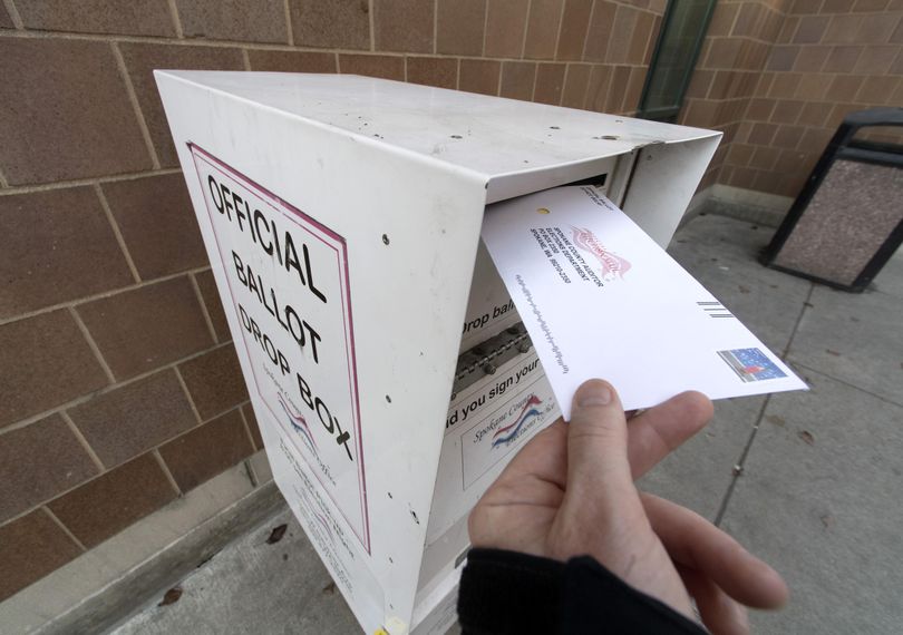 An election ballot is placed in ballot box outside of the Spokane Public Library on Nov. 7, 2016, downtown Spokane. (Colin Mulvany / The Spokesman-Review)
